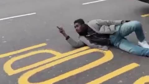 Man blocks bus in London street