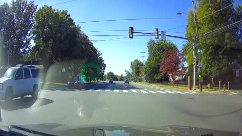 Near Miss With Motorcycle as Pickup Runs Red Light