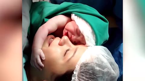Viral video of a newborn baby clinging to her mom's face