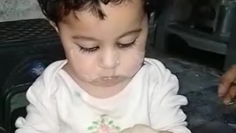 Funny baby making bread