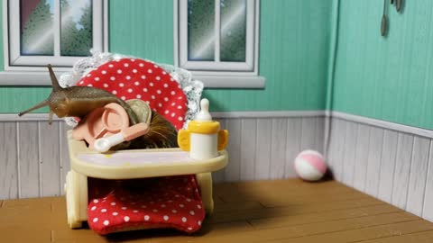 Happy snail sits in tiny highchair