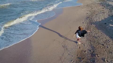 Happy woman enjoying the beach