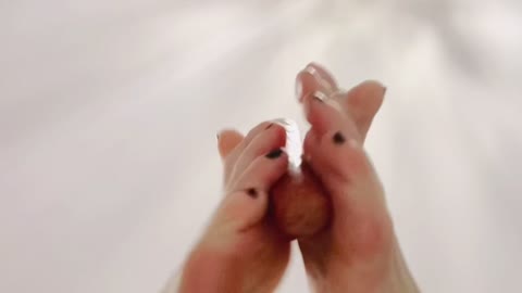 Foot play with a hotdog