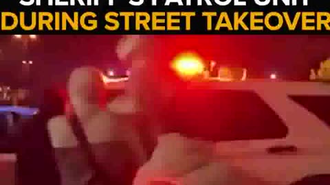 A California Deputy in a patrol car comes under attack during a street takeover.
