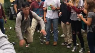 Guy in gray shirt gets tripped and tackles guy