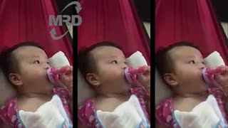 Baby drinking bottle milk - 3 months old