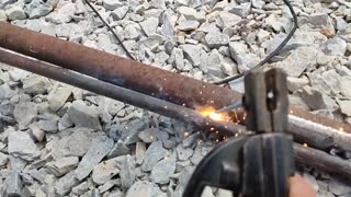 welding two pipes in slow motion