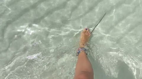 Woman Walking On White Sand Of Sea Water