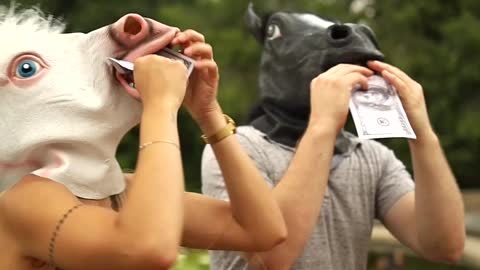 People with pony mask eating phony parer money