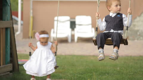 Boy and girl swing
