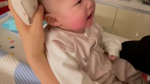 Laughing baby with grandma