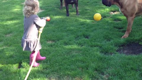 baby doing fun with dog