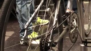 Silver bike locked to subway train pole