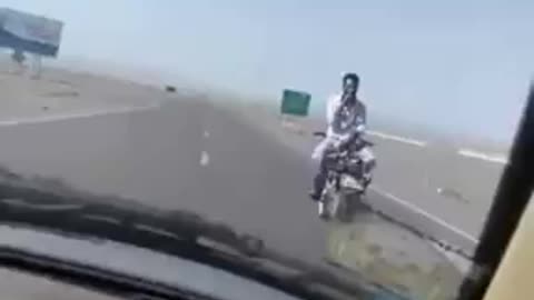 Riding motorcycle backwards in highway