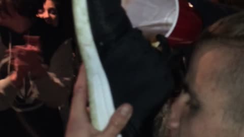 kid drink from shoes at party