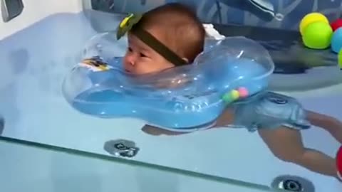 Baby pool syming baby