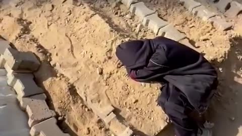 A deafening silence: Palestinian boy cries at parent's grave