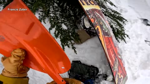 snowboarder rescues skier