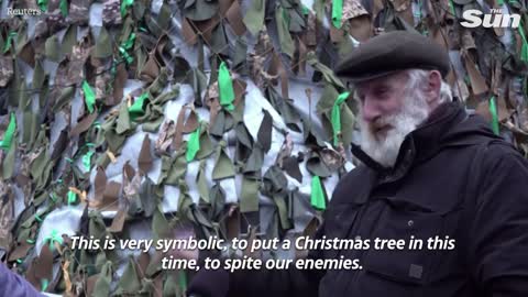 Ukraine wartime Christmas tree made of camouflage nets on show in Mykolaiv