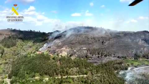 Aerials show burning mountains in northern Spain