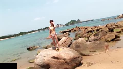 Japanese bikini girl frolicking in the beach