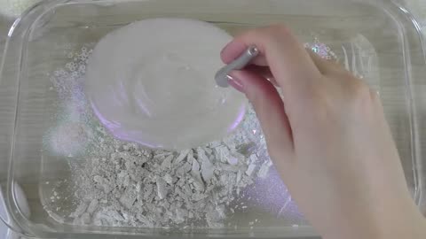 White slime mixing makeup and glitter into clear slime satisfying slime