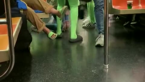 Gang of women in neon green bodysuits attack passengers on NYC subway