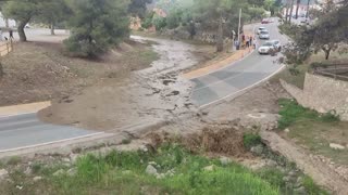 Floodwater blocks road in Spain amid rain warning