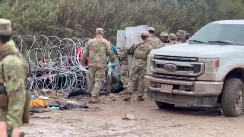 TX National Guard soldiers using riot shields to push back illegal invaders