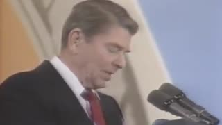 President Reagan reacts to a balloon popping during his speech in 1987