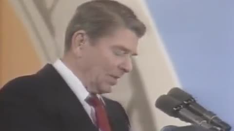 President Reagan reacts to a balloon popping during his speech in 1987