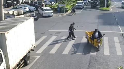 Woman Gets Dragged Along The Street By Passing Trike
