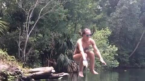 Grand daughter jumping in the river