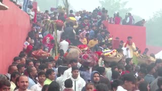 Indians celebrate festival in toxic, foam-covered river