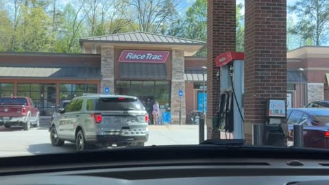 Police Car Drives Off With Gas Pump