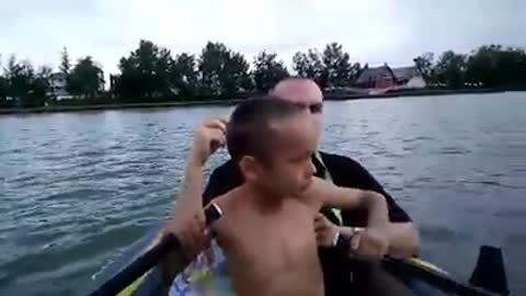 6 year old boy's first time rowing a boat