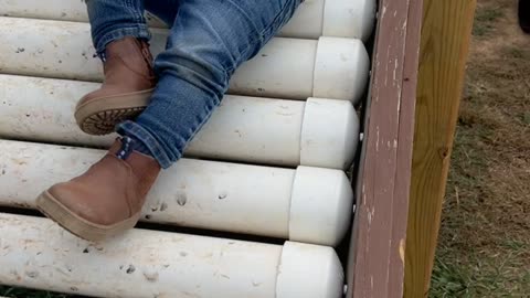 Kid Takes a Tumble on Roller Slide