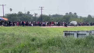 Hundreds of migrants gathering for Border Patrol processing - they are coming non stop.