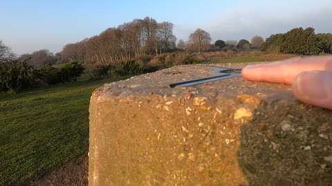 Touch a trig point in Stockbridge. England.