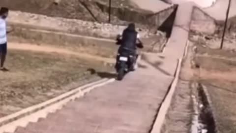 -Wow- Man Crashes Down a Flight of Steps on Motorcycle