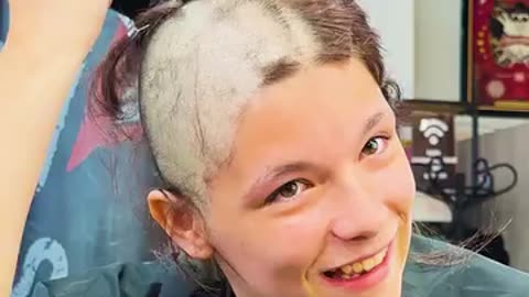 All the barbers shaved their hair together with a kind girl