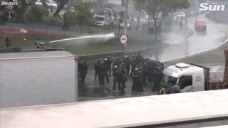 Brazilian police fire water cannons and rubber bullets at anti Lula protesters