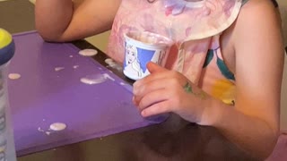 Twin 4-Year-Old Girl Bored with Yogurt
