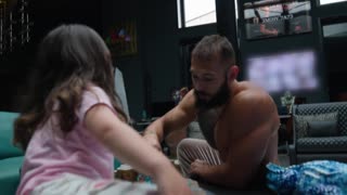 Andrew Tate plays with his daughter