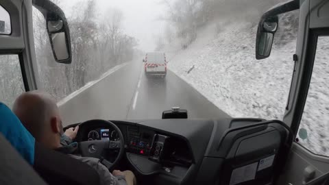 Bus drive in the Alps, snow season, 4K