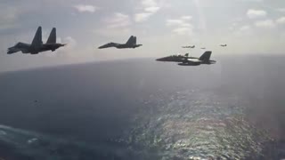 SU-30 Flankers Fly in Formation with USN's Super Hornets in the South China Sea