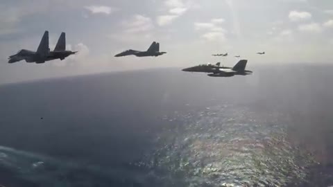 SU-30 Flankers Fly in Formation with USN's Super Hornets in the South China Sea