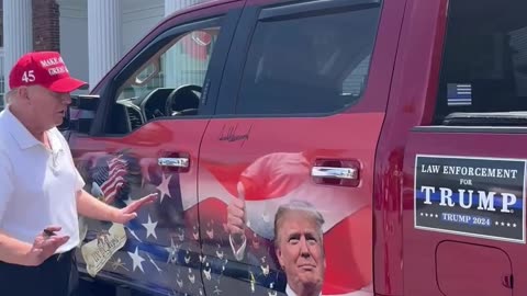 Donald Trump signing a supporters beautiful truck