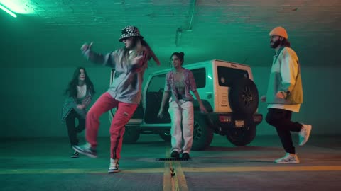 Breakdancers performing in the underground parking