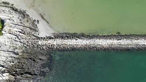 Jetty Waves Coast Footage Clip ( A Drone Shot )